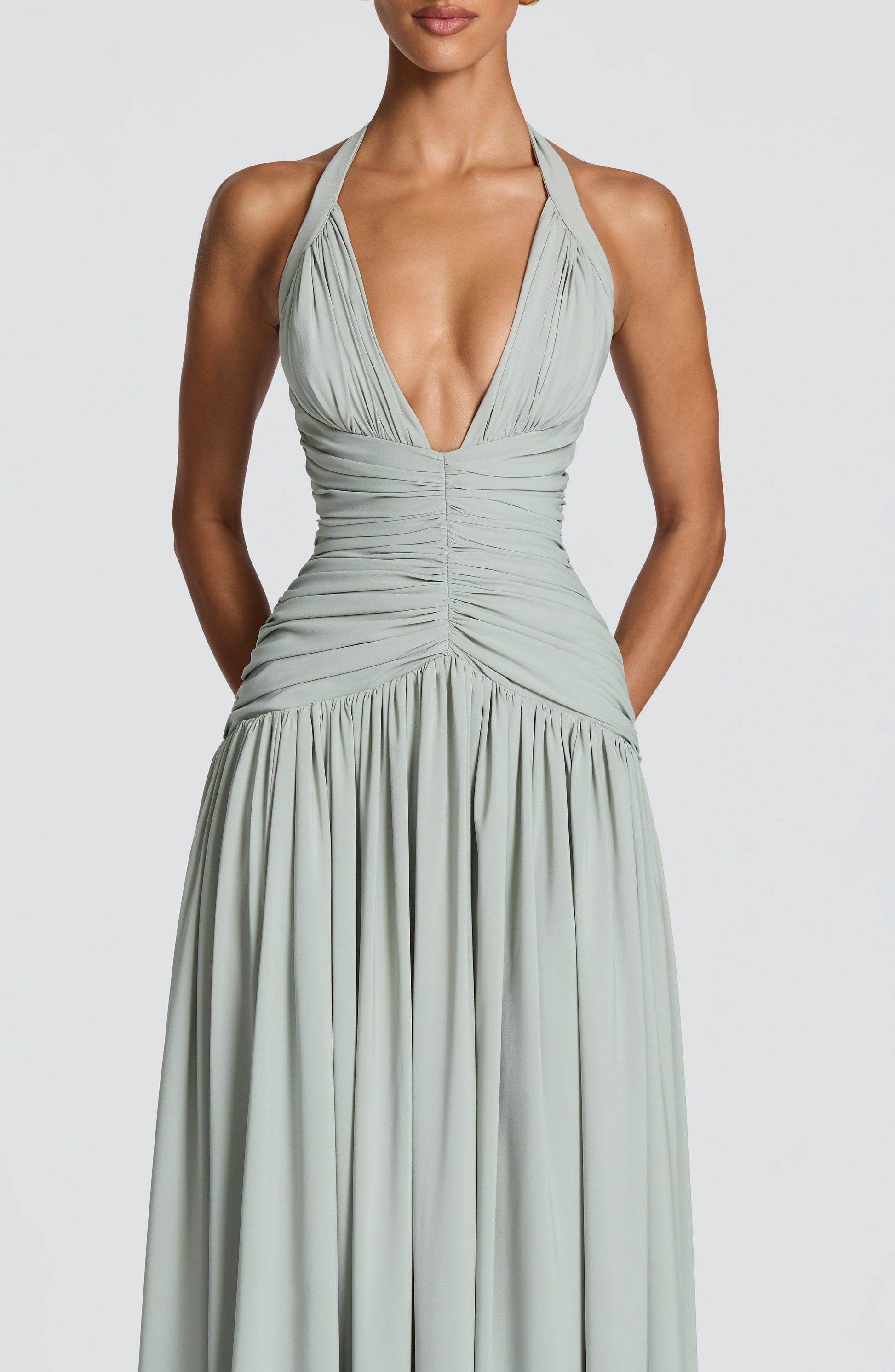 Women's sage green talia halter maxi dress, styled view