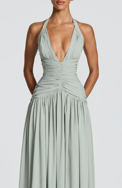 Women's sage green talia halter maxi dress, styled view