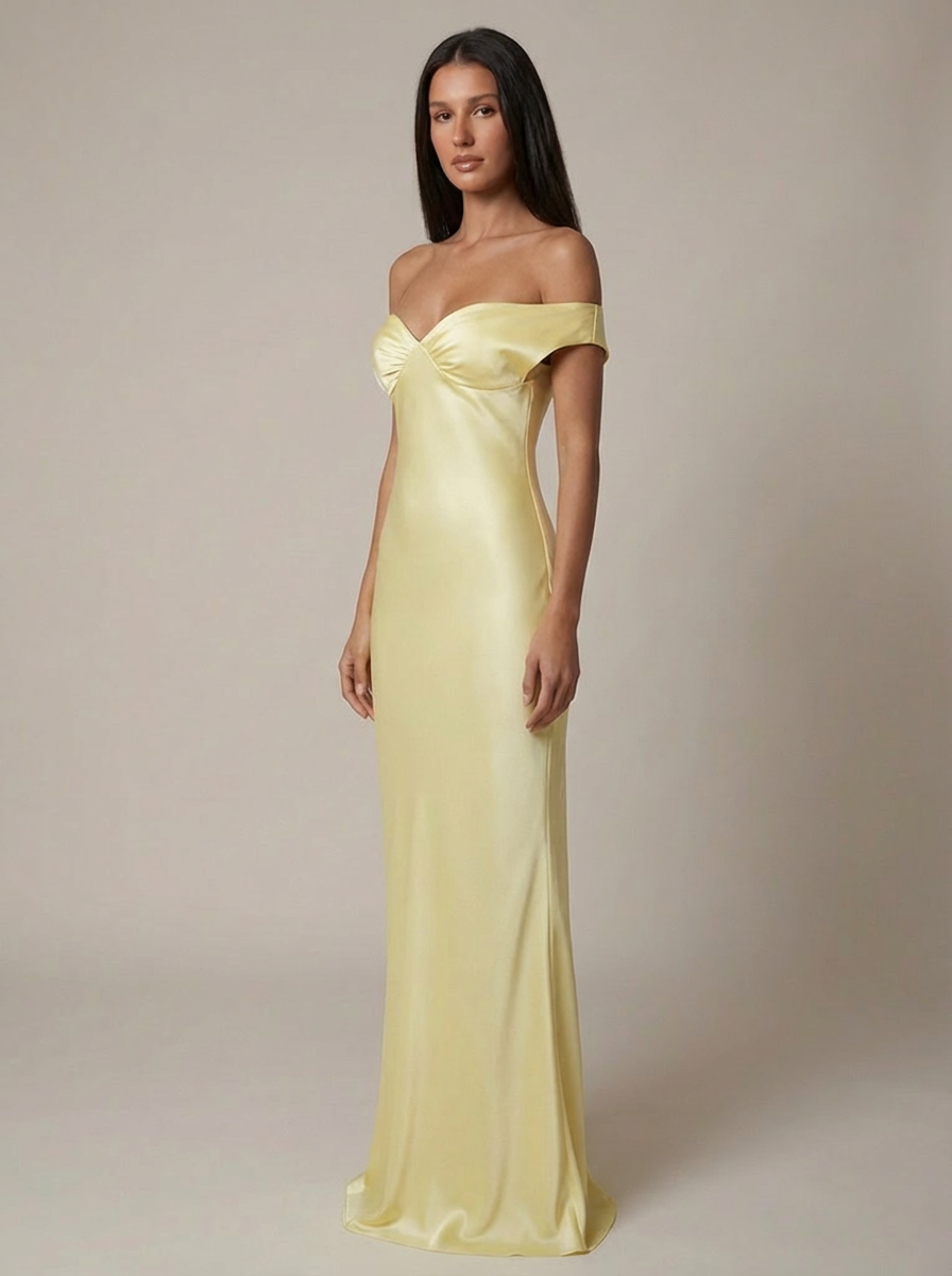 Three-quarter view of yellow satin off-shoulder maxi dress with smooth fitted bodice