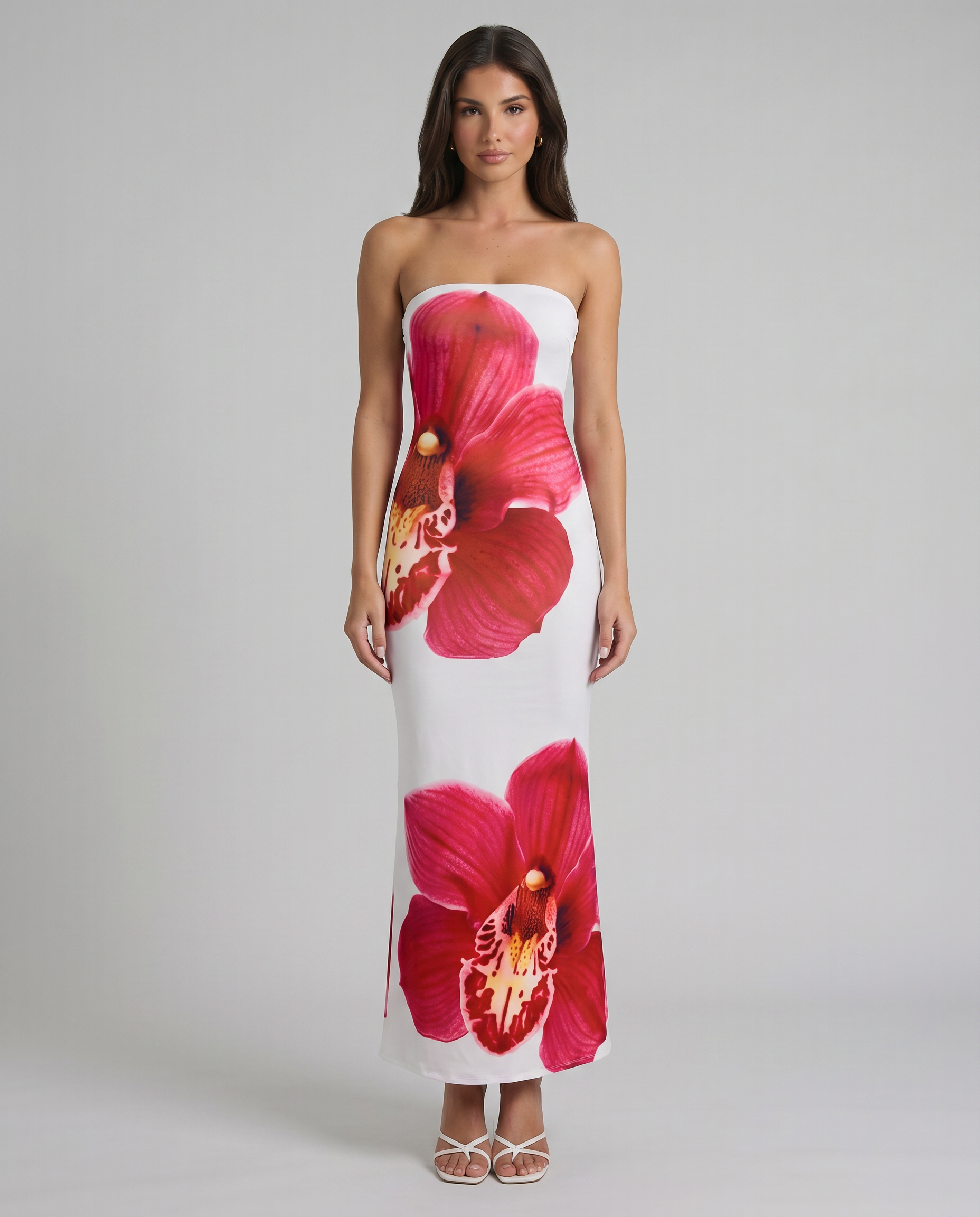 Strapless white maxi dress with bold red orchid floral print, full-length front view