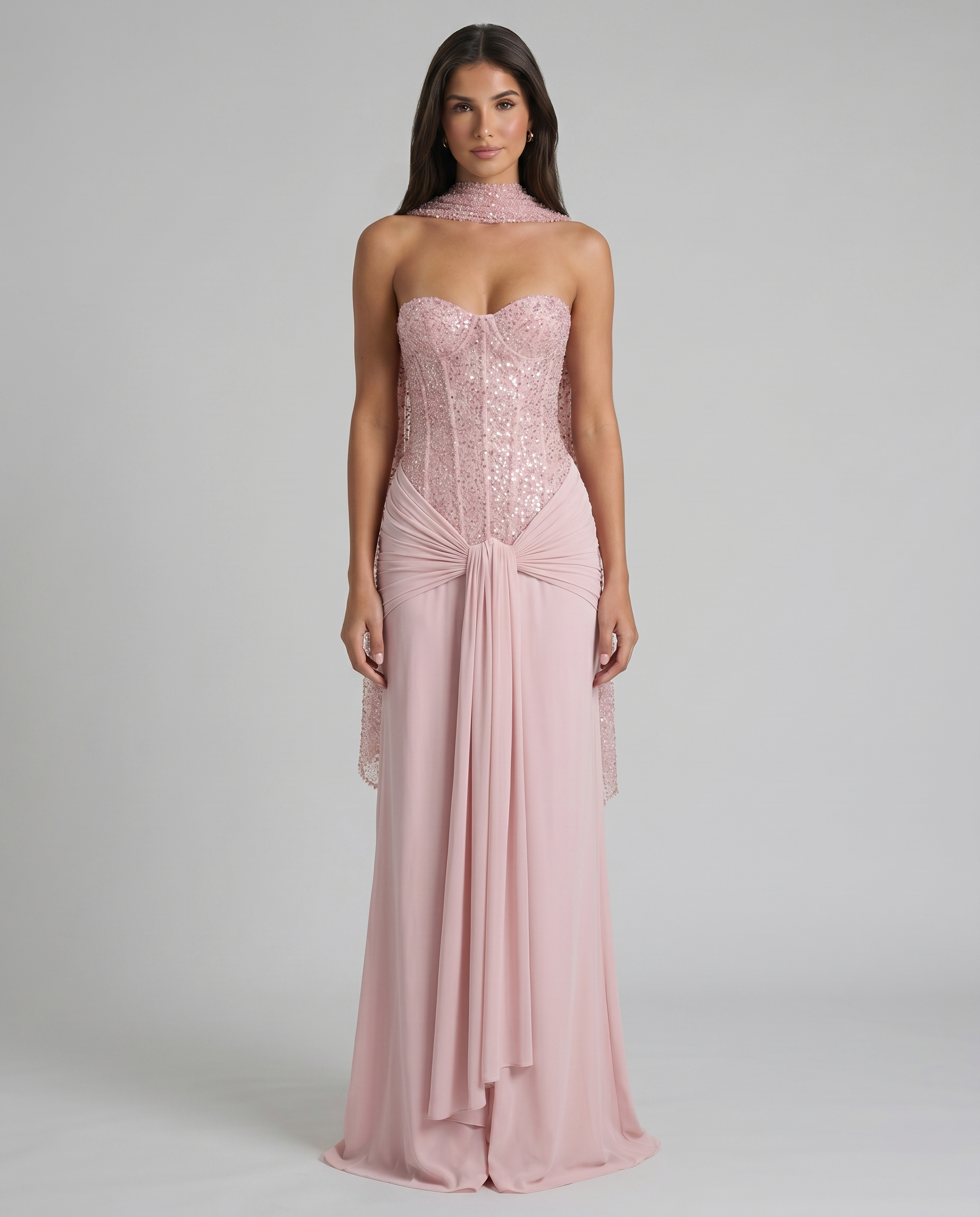 Straight-on view of blush pink maxi dress featuring strapless sweetheart sequin bodice and flowing skirt
