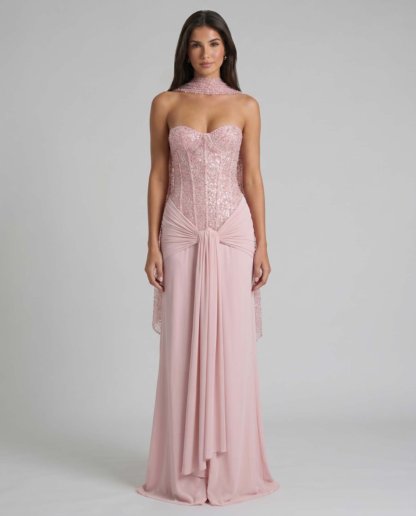 Front full-length pink maxi dress with sequin corset bodice, choker scarf, and draped waist knot