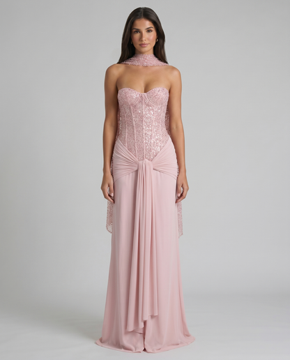 Front full-length pink maxi dress with sequin corset bodice, choker scarf, and draped waist knot