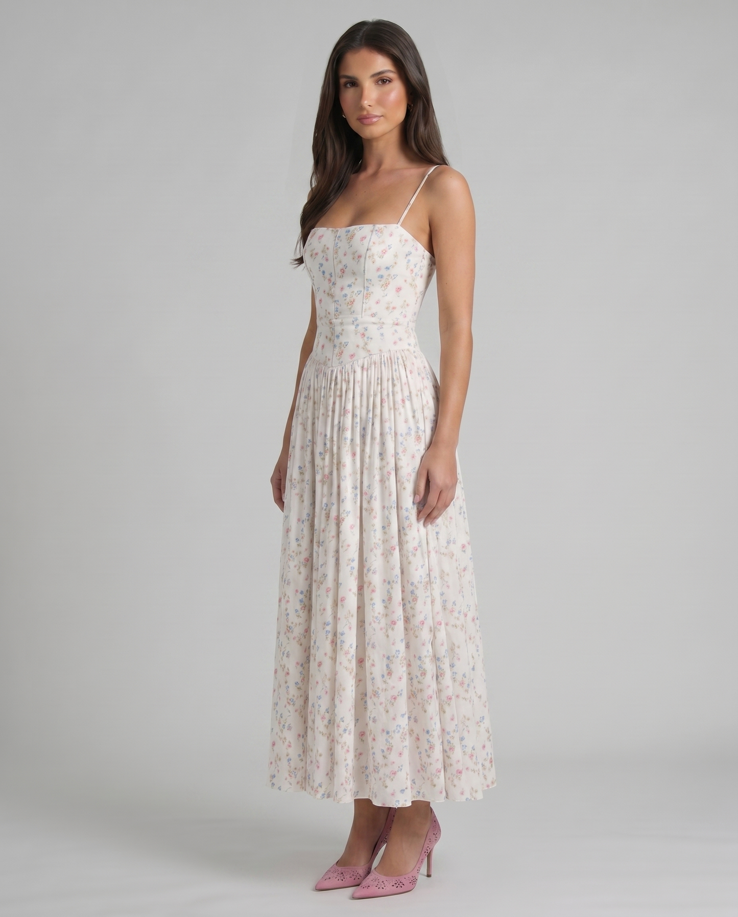Three-quarter front view of cream floral midi dress highlighting fitted top, airy skirt and midi hem