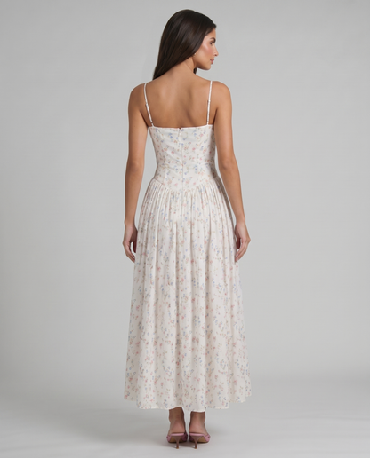 Cream floral midi dress back angle highlighting fitted waist, zip closure and soft drape of skirt