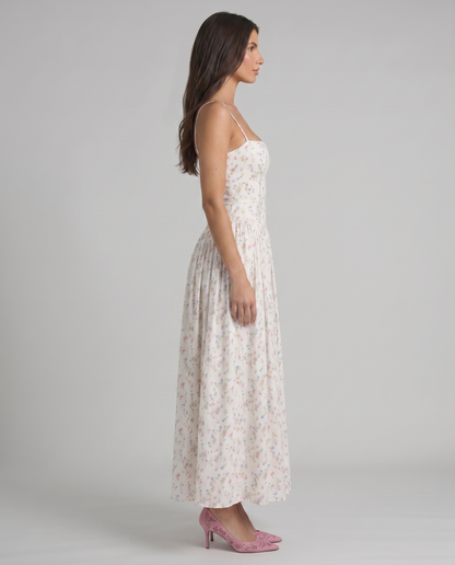 Cream floral midi dress side view with straight neckline and gathered skirt, showing silhouette and drape