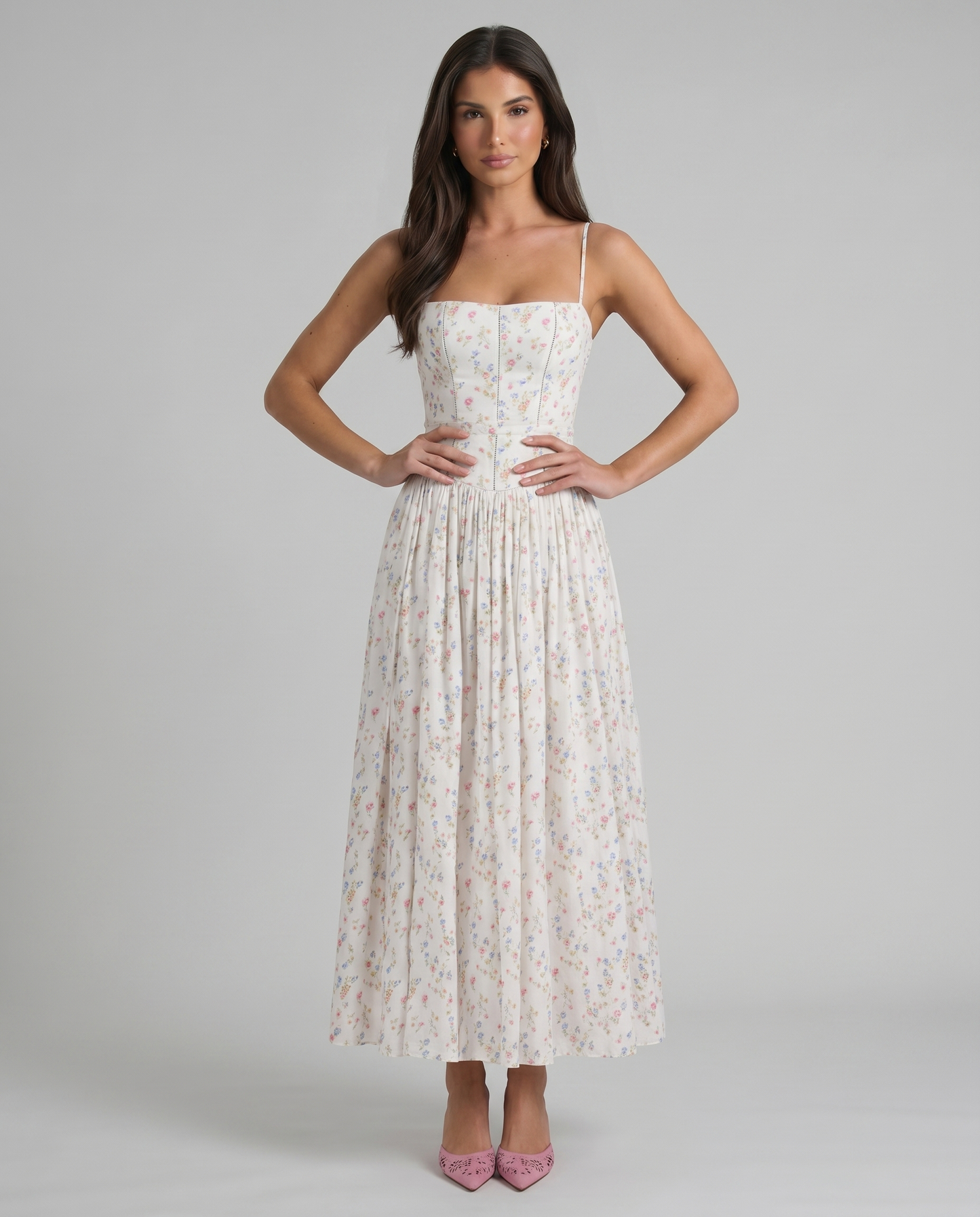 Cream floral midi dress with spaghetti straps, fitted bodice seams and gathered skirt, front view