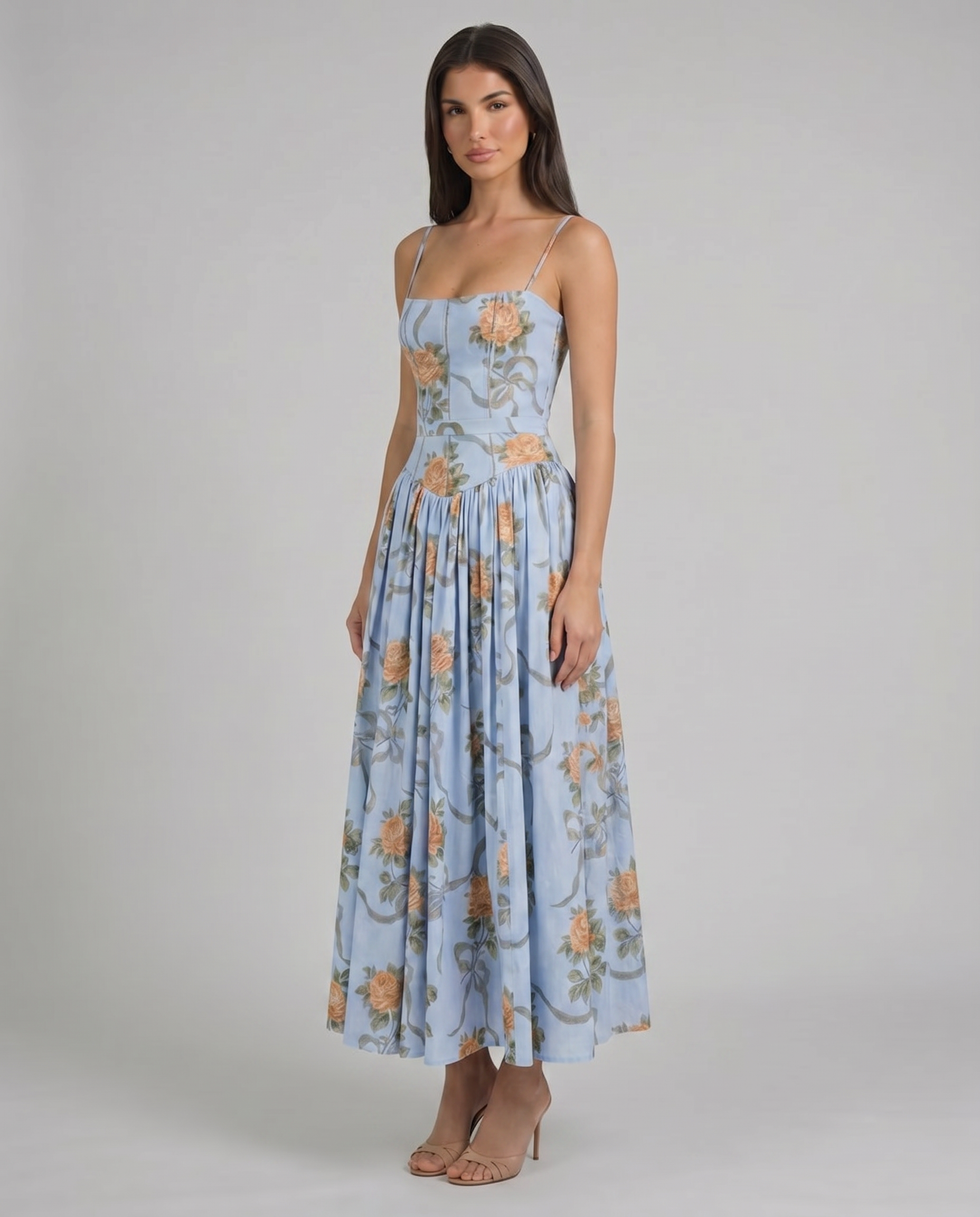 Blue floral midi dress skirt detail with peach rose pattern and soft gathers for a flowy finish