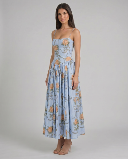 Blue floral midi dress skirt detail with peach rose pattern and soft gathers for a flowy finish