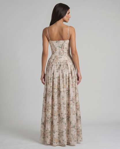 Three-quarter view of green floral midi dress showing fitted bodice seams and gathered skirt