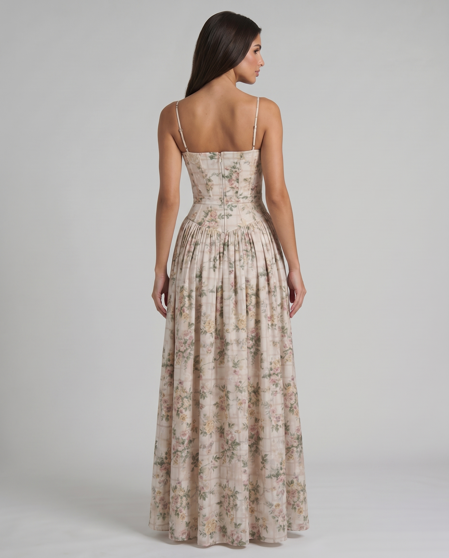 Detail shot of green floral midi dress showing floral print, corset-style paneling and waist seam