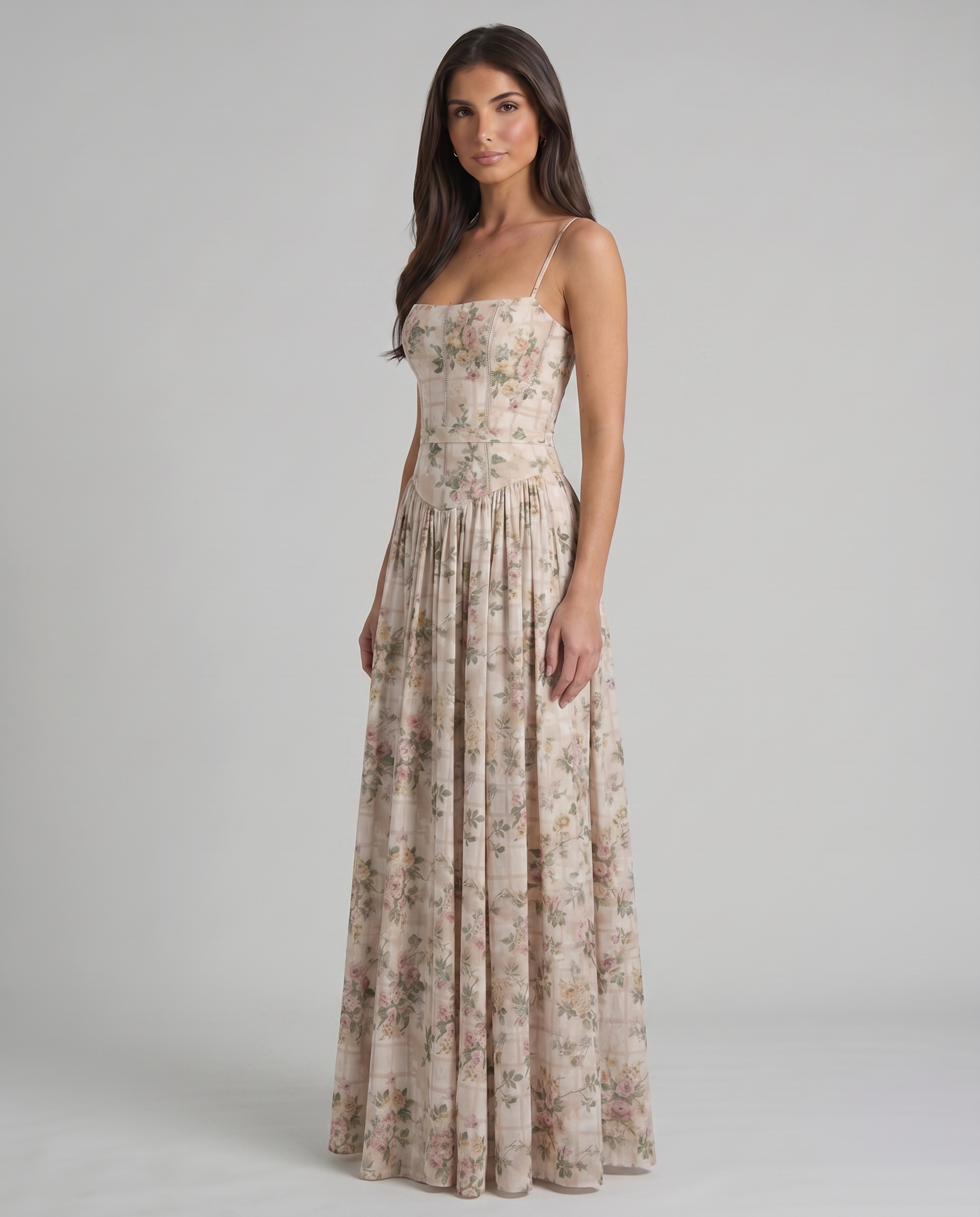 Front mid-length view of green floral midi dress with structured bodice, waist panel and pleated skirt