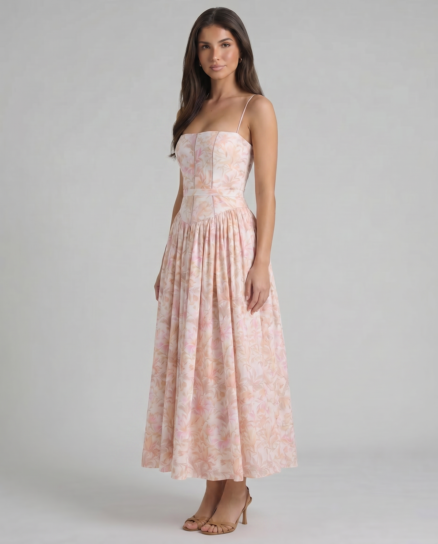 Angled front view peach floral midi dress highlighting gathered skirt volume and waist seam