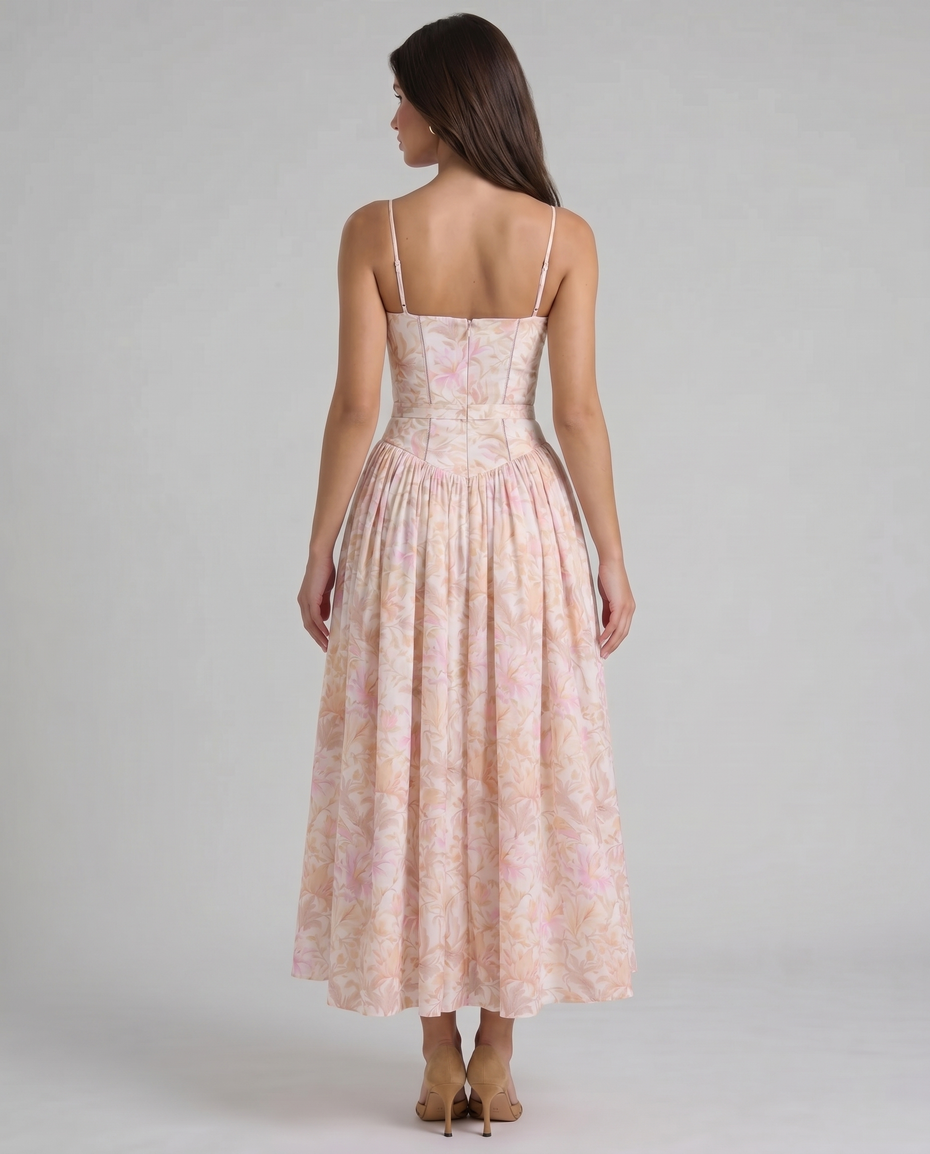 Rear three-quarter view peach floral midi dress with structured bodice and flowing skirt