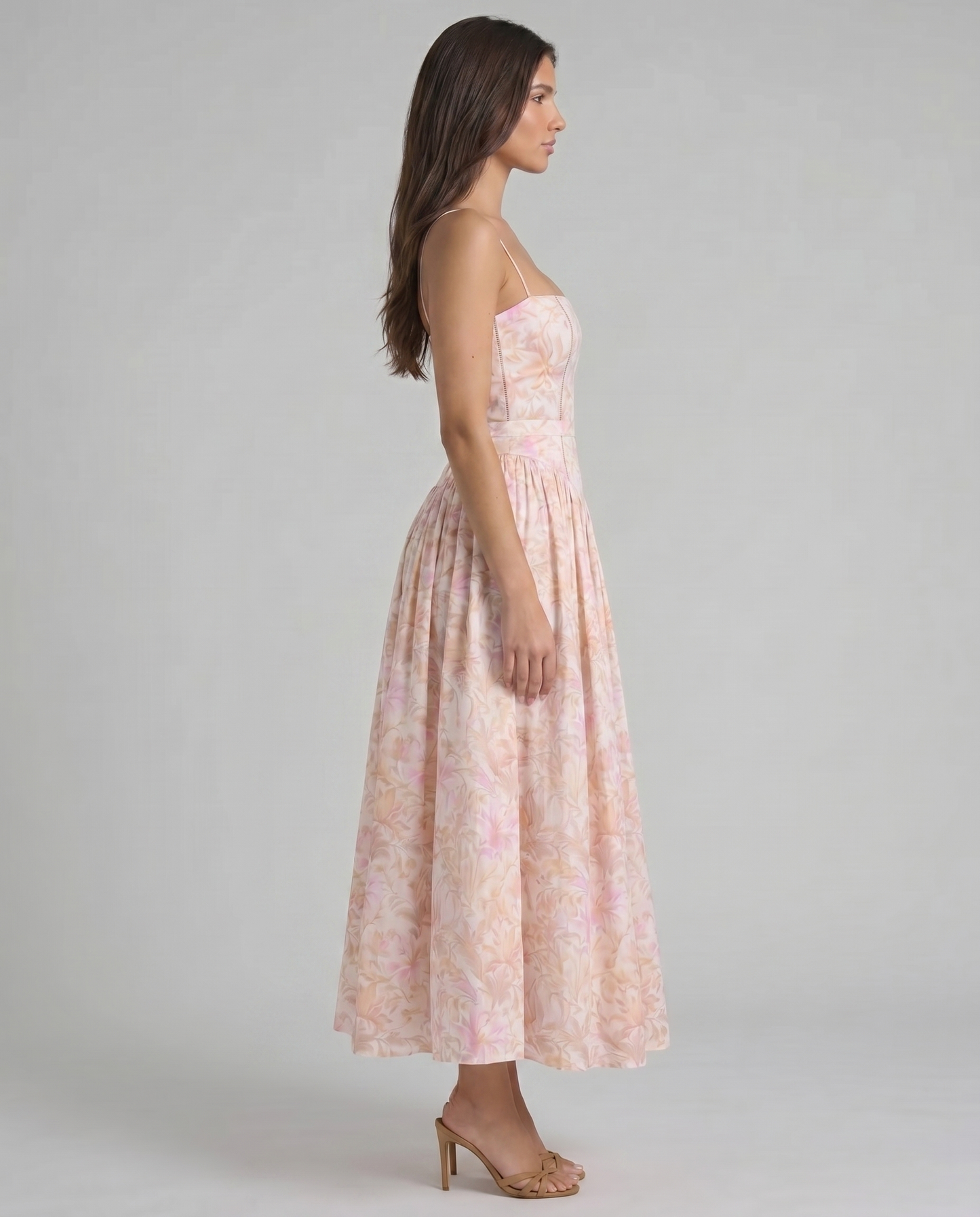 Left side view peach printed midi dress showing clean side seam and midi length hemline