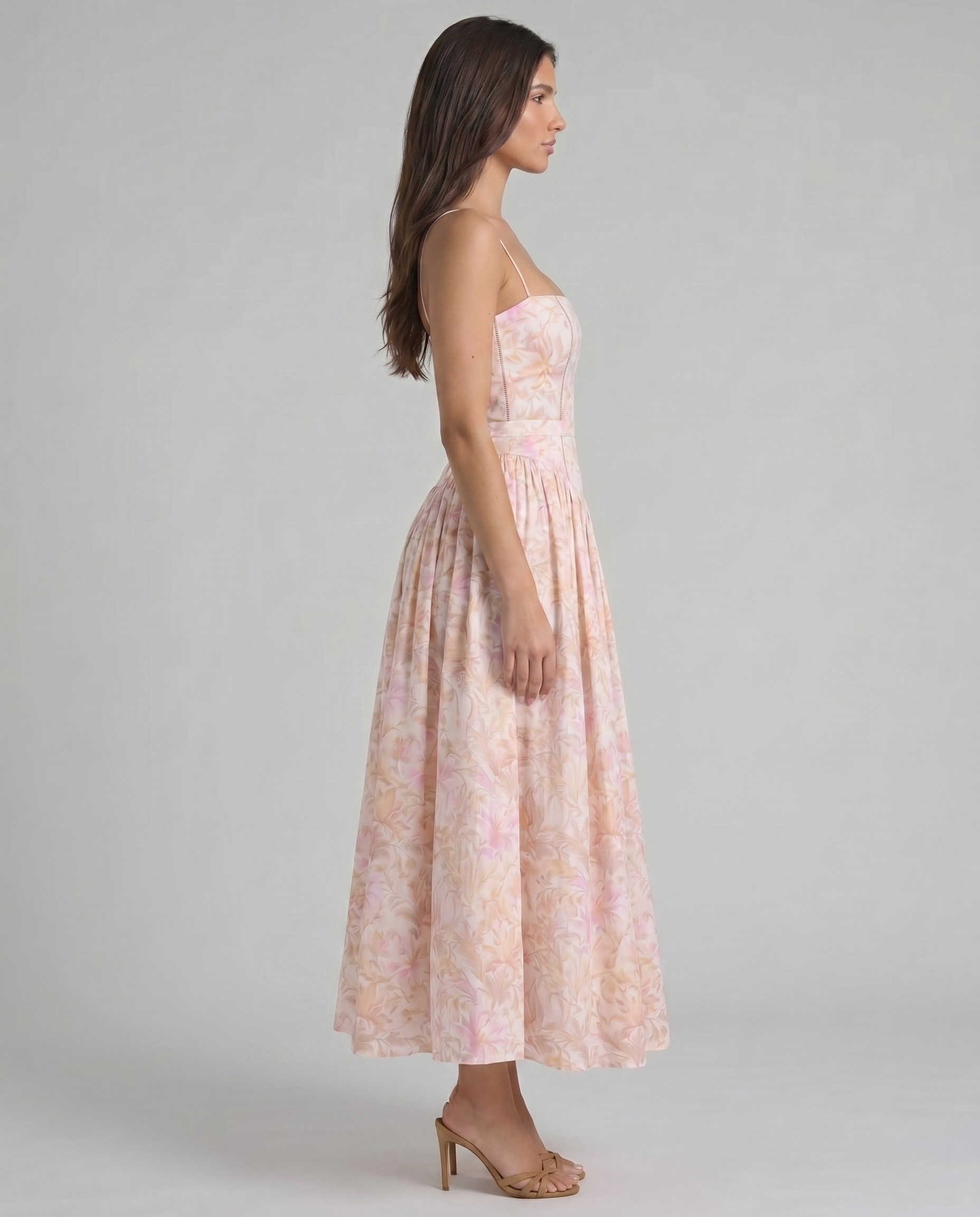 Left side view peach printed midi dress showing clean side seam and midi length hemline