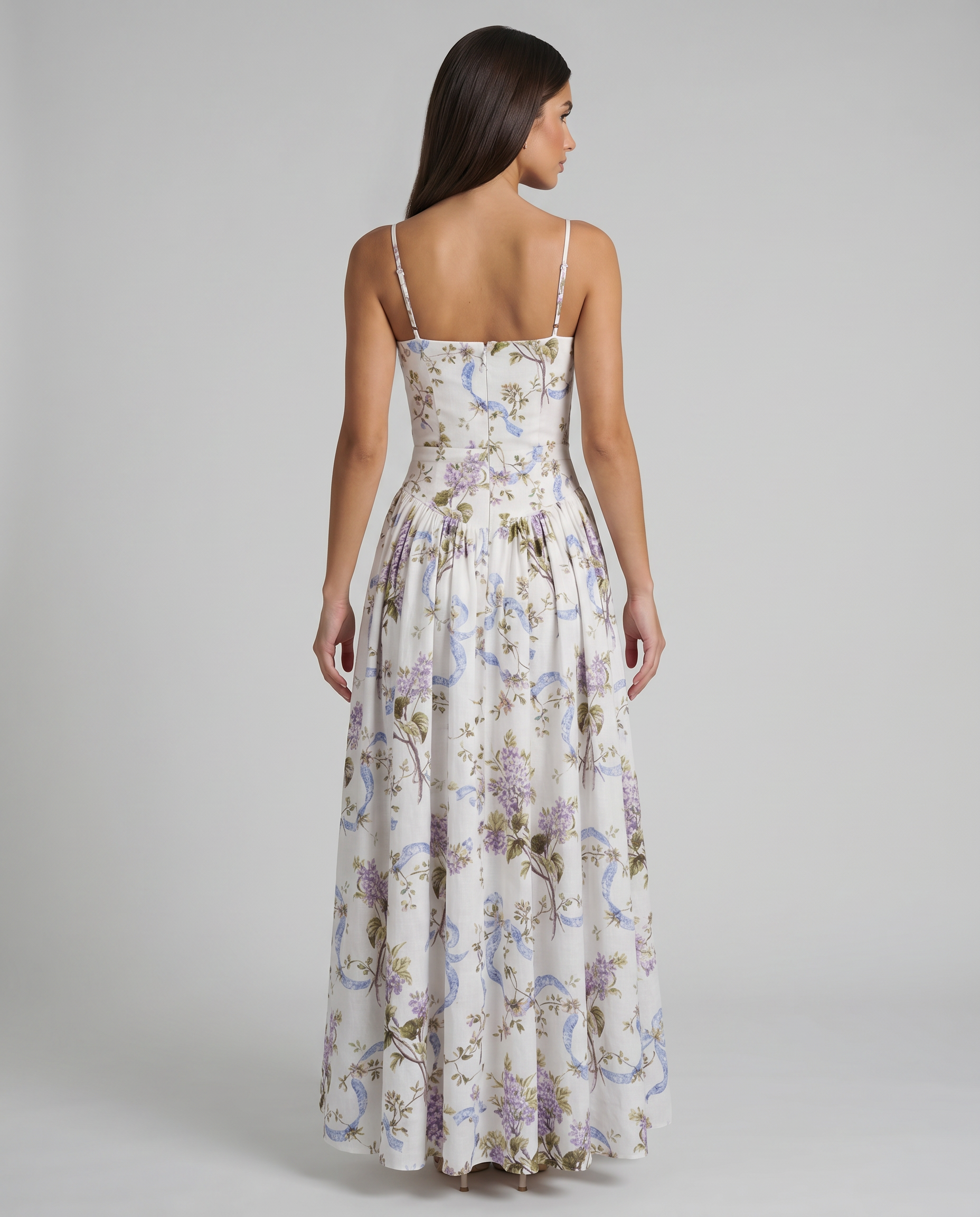 Back view of purple floral midi dress showing straight back neckline, thin straps, and full skirt