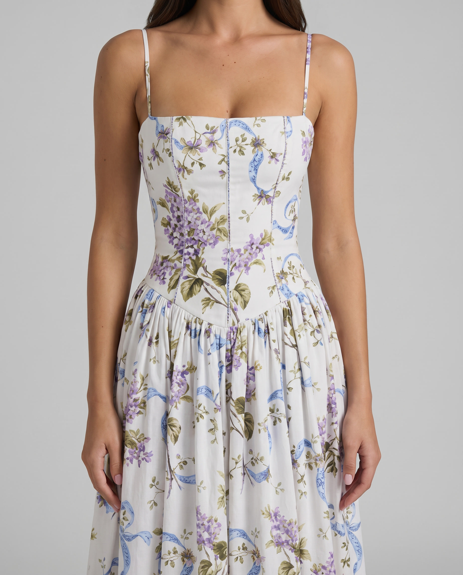 Close-up of square neckline and corset bodice on purple floral midi dress with seam detailing