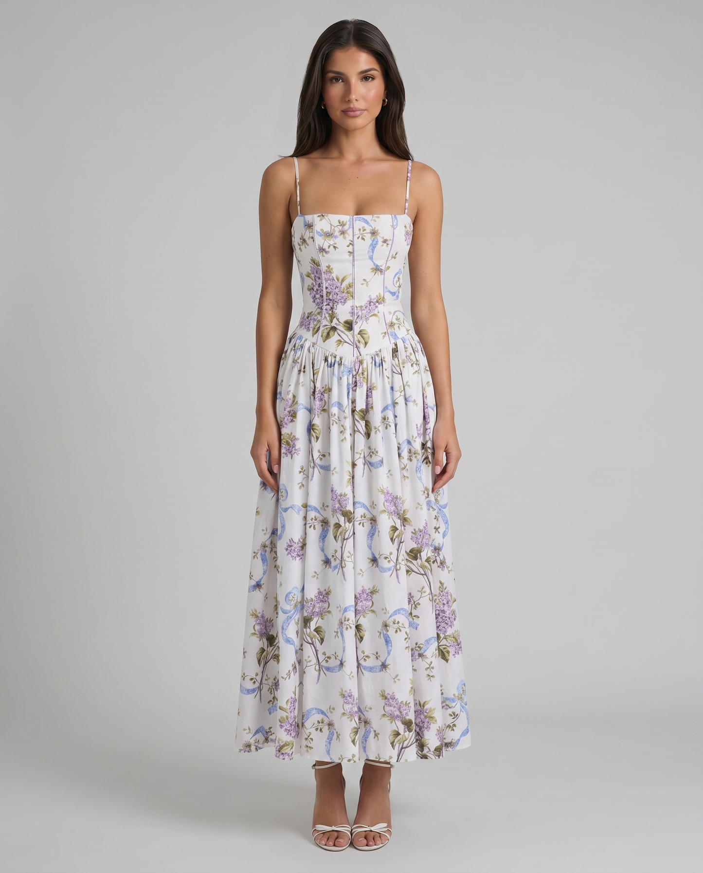 Full-length front shot of purple floral midi dress with corset-style waist and flowing skirt panels