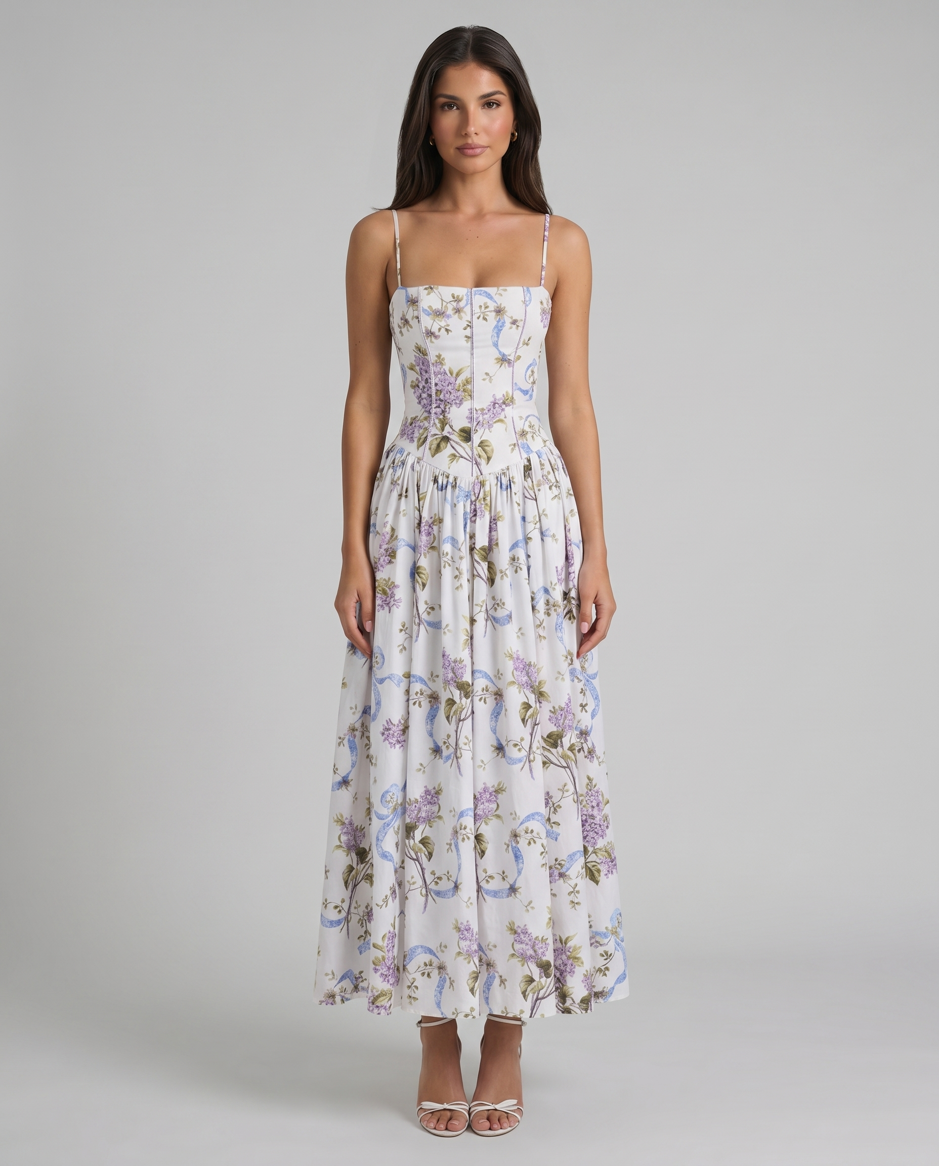 Front view of purple floral print midi dress with square neckline, corset seams, and flowy skirt