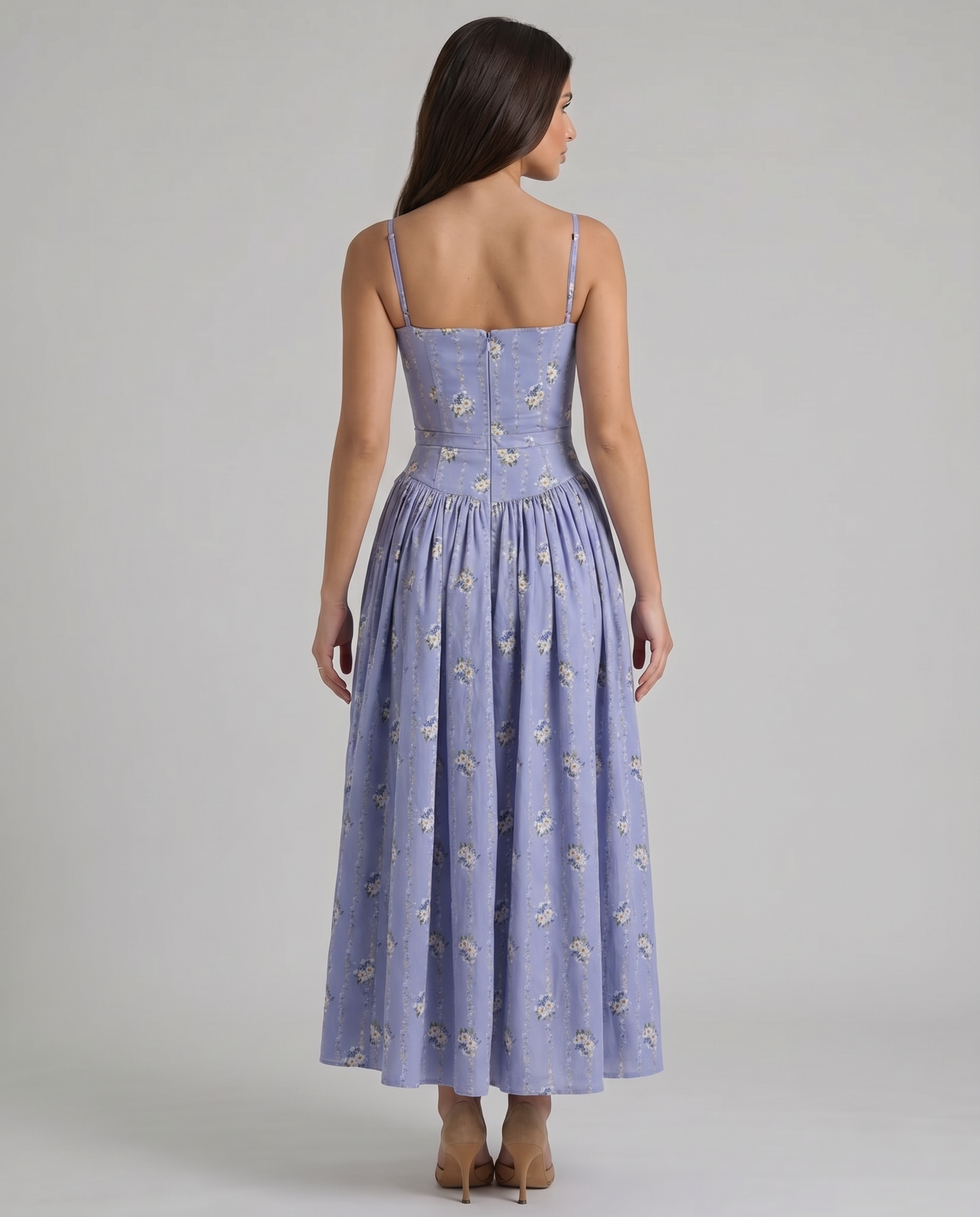 Back view of violet floral midi dress showing thin straps, structured bodice seams and flared skirt
