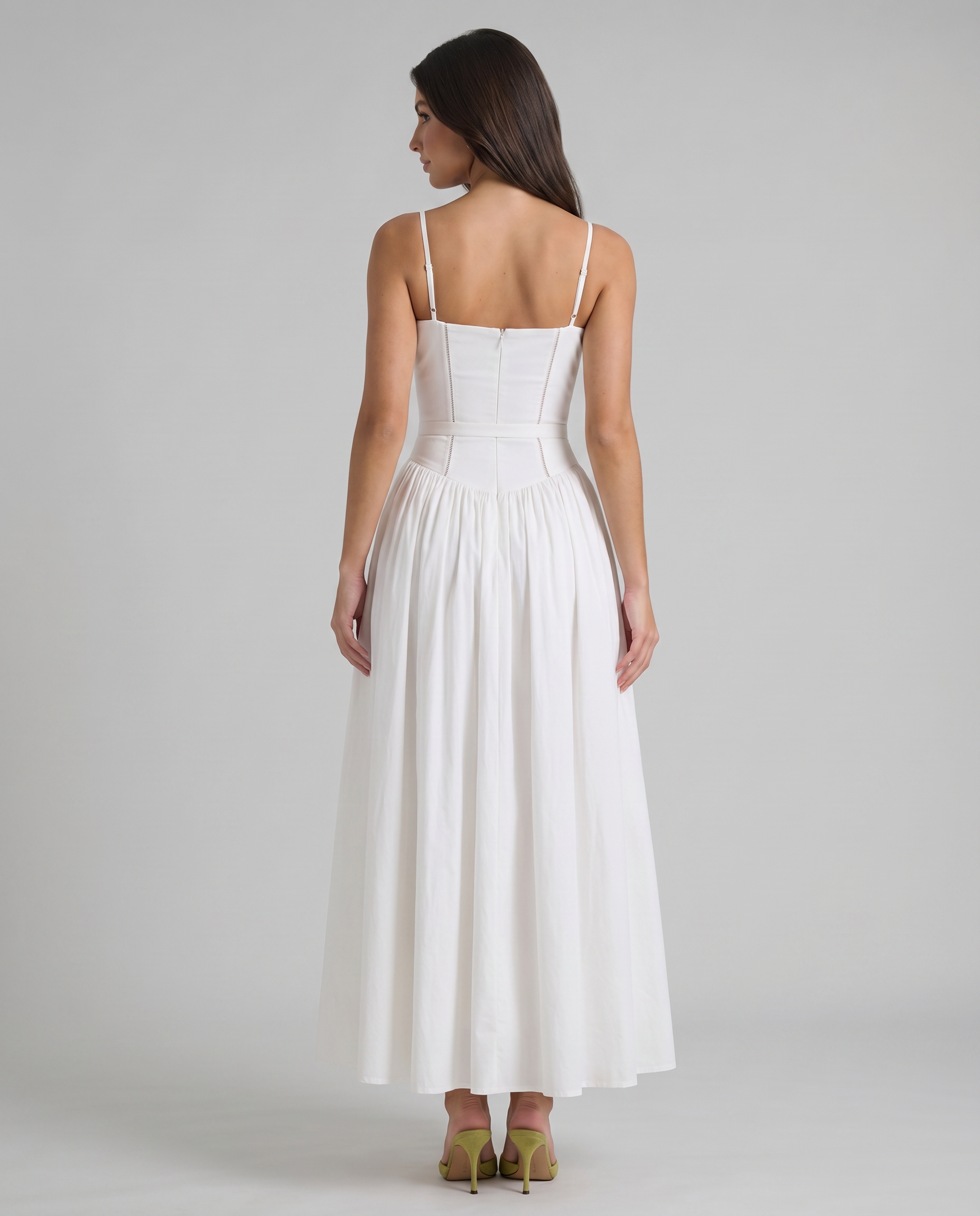 Back upper view of white midi dress highlighting zipper closure, strap adjusters and bodice seams