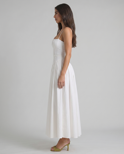 Front mid-length view of white midi dress with square neck, corset seams and softly pleated skirt