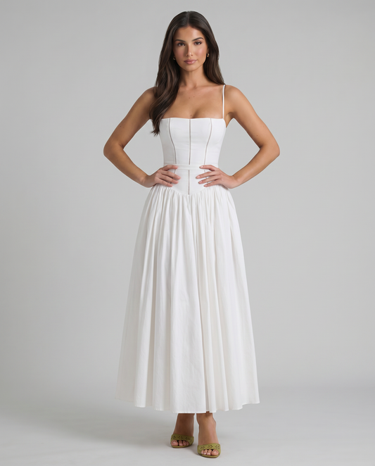 White midi dress with spaghetti straps, fitted corset bodice and flowy gathered skirt, front view