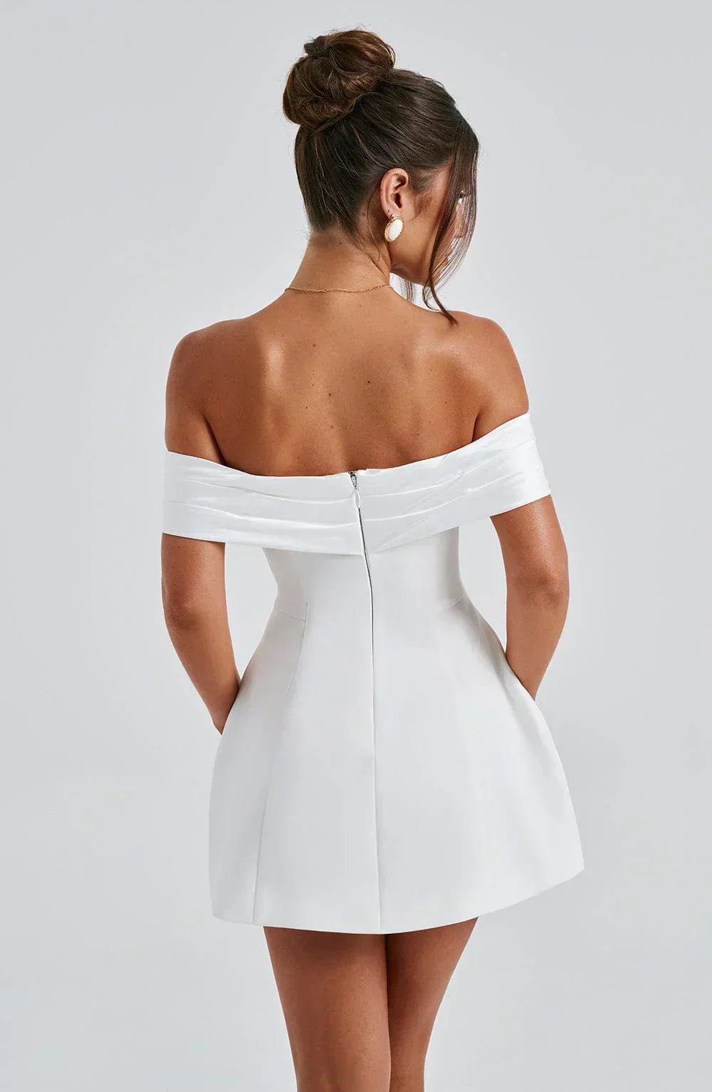 Back view white off-shoulder mini dress with center back zipper and structured flared skirt
