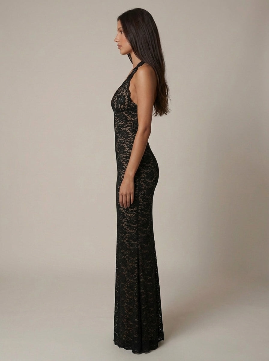 Side profile black lace maxi dress showing halter plunge neckline, slim fit through hips and long skirt