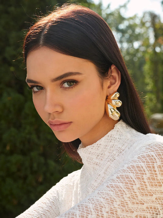 Women gold statement earrings with clustered molten petal shapes