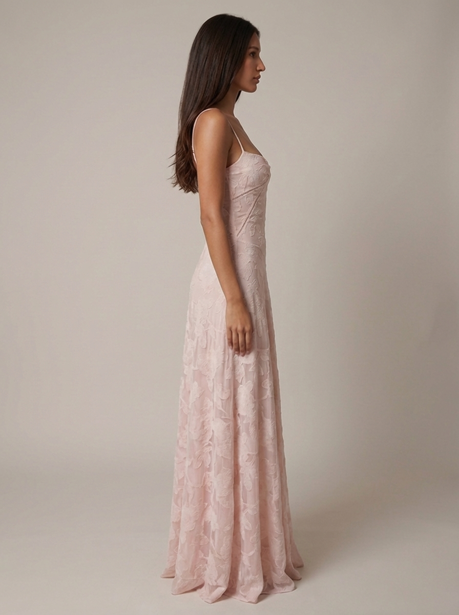 Profile shot of pink floral jacquard maxi dress highlighting smooth silhouette and long skirt drape
