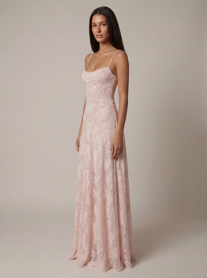 Back view of blush pink flower maxi dress with lace-up corset detail and floor-length skirt