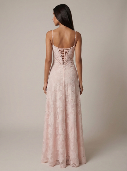 Rear shot of pink floral jacquard maxi dress showing lace-up back panel, slim straps and long hem