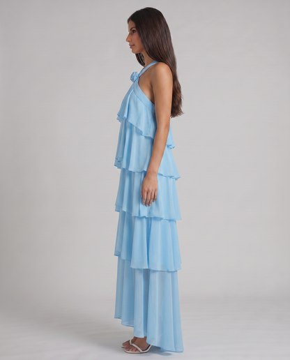 Profile view of light blue flower ruffle maxi dress with airy tiered skirt and draped bodice
