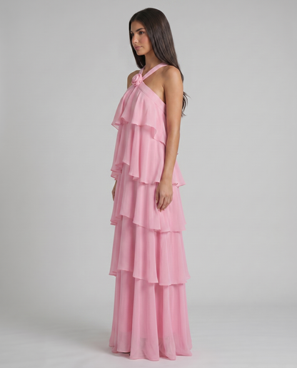 Profile shot of pink flower ruffle maxi dress highlighting layered chiffon tiers and relaxed, flowing silhouette