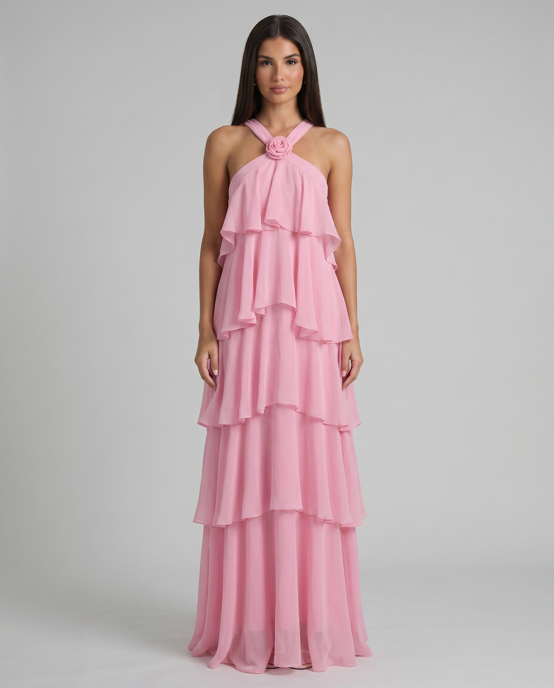 Pink flower ruffle maxi dress with crisscross halter straps, rosette detail, tiered chiffon skirt
