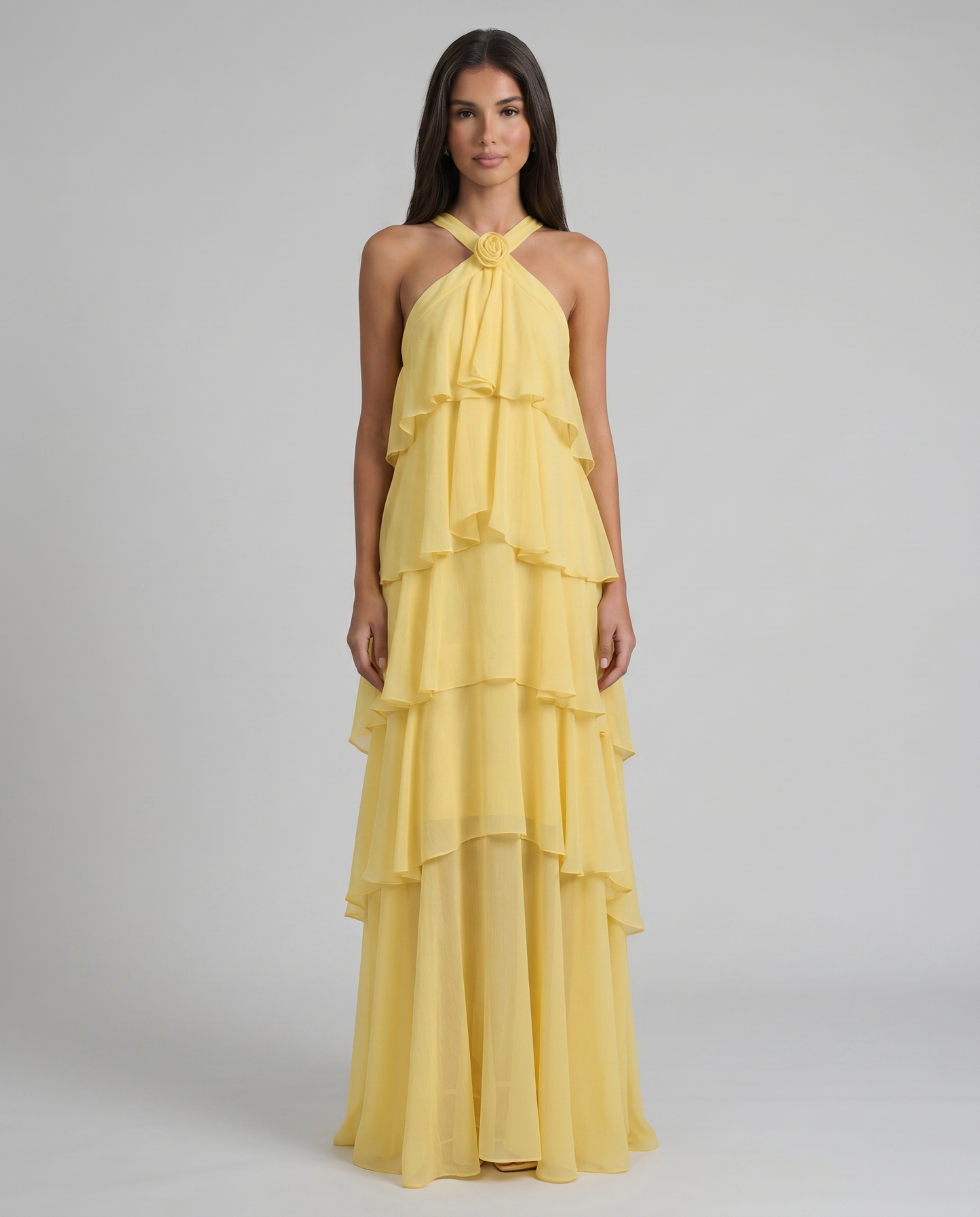 Front view yellow flower ruffle maxi dress with halter neckline and tiered chiffon skirt