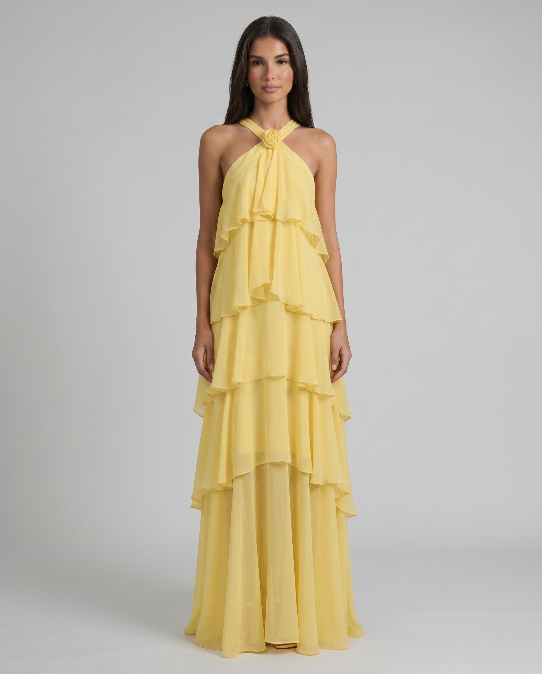 Front view yellow flower ruffle maxi dress with halter neckline and tiered chiffon skirt