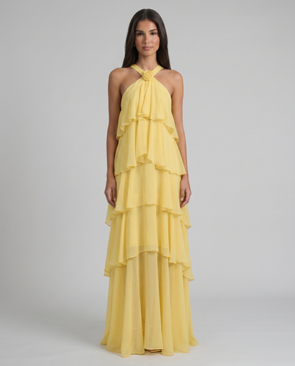 Front view yellow flower ruffle maxi dress with halter neckline and tiered chiffon skirt