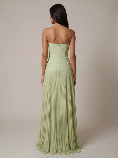 Back view of green forest maxi dress with strapless top, center back zipper, and pleated skirt