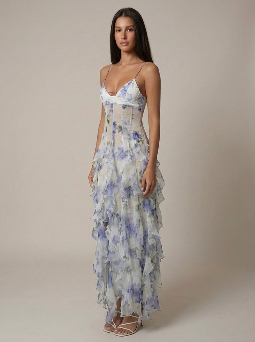 Blue floral maxi dress with layered tiered ruffles and thin straps for women, side profile view