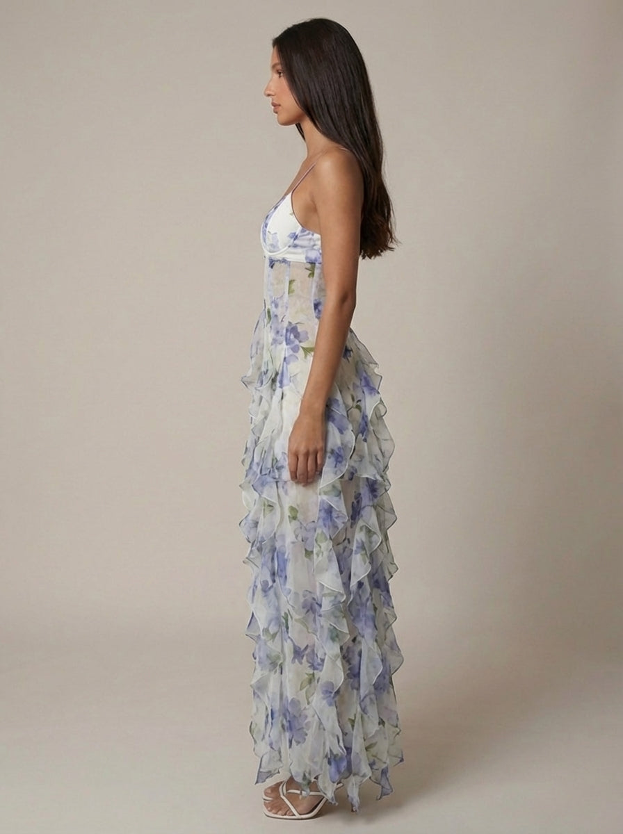 Blue floral maxi dress showing fitted bodice and flowing ruffle hem for women, detail-focused view