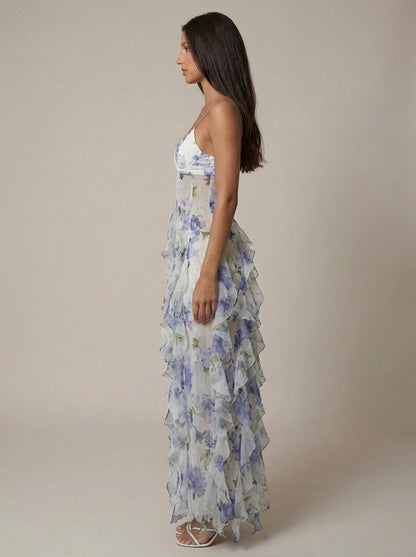 Blue floral maxi dress showing fitted bodice and flowing ruffle hem for women, detail-focused view
