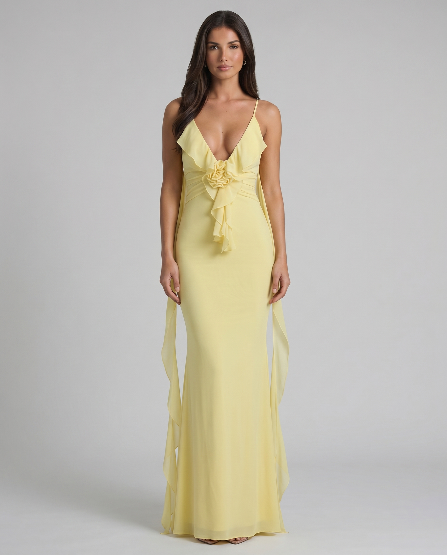 Yellow maxi dress with deep V neckline, spaghetti straps, rosette ruffle detail and floor-length skirt
