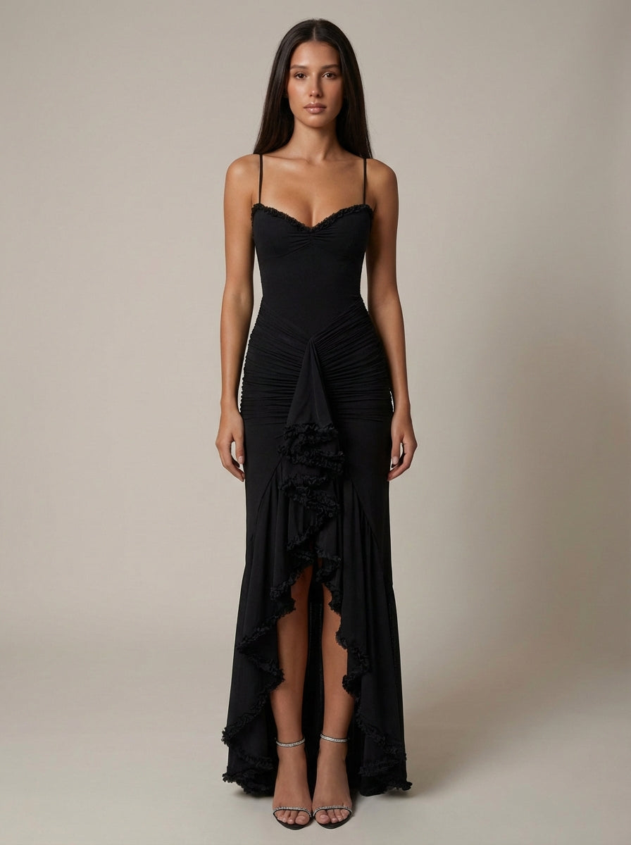 Front view black ruched maxi dress with lace trim bodice, draped panel and thigh-high slit