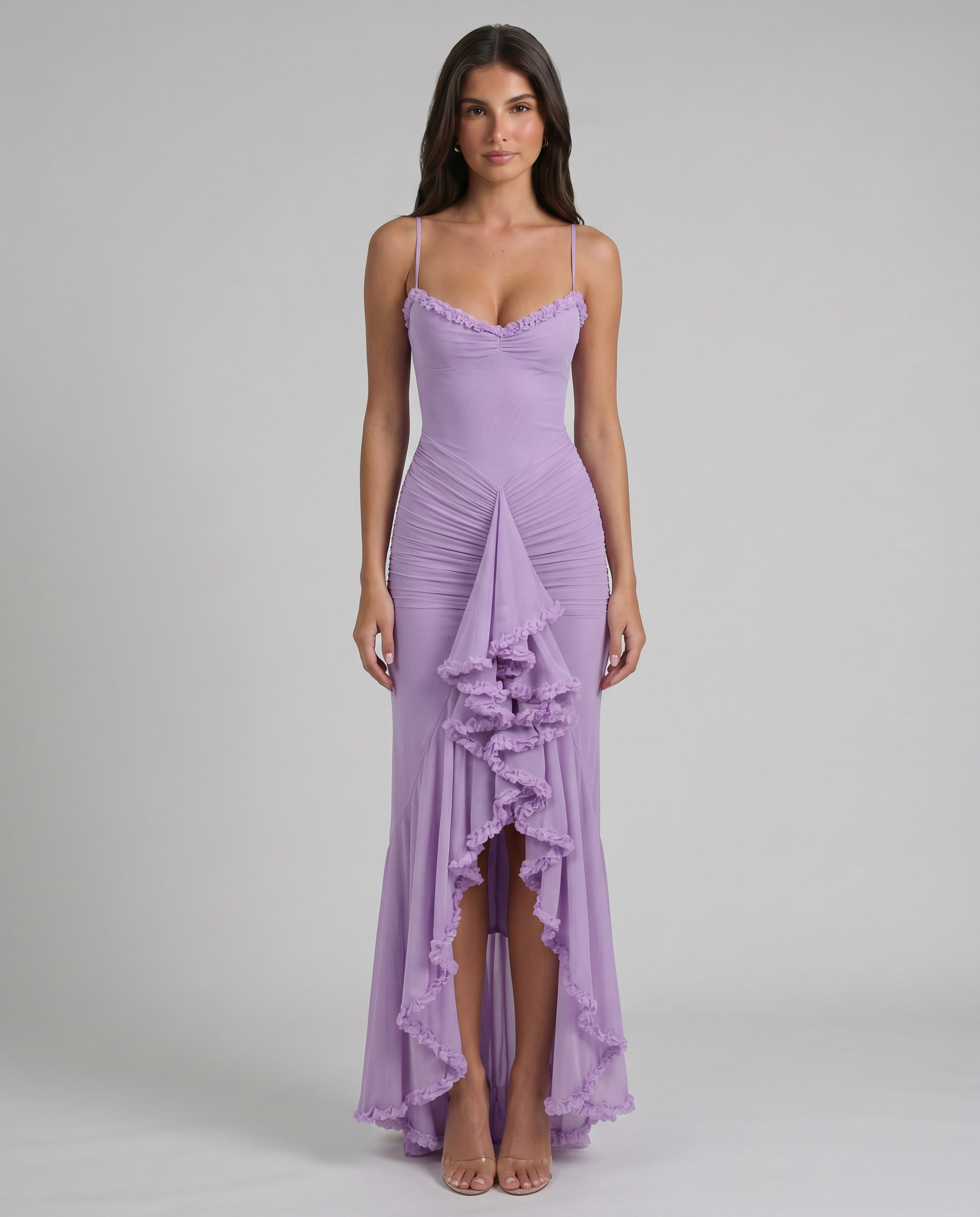 Front mid-length view of purple maxi dress highlighting ruched waist, front drape, and ruffle trim