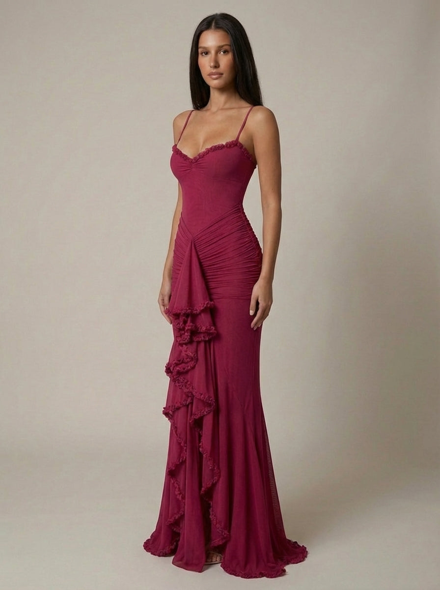 Deep red fitted maxi dress angled view showing sweetheart lace trim, ruched skirt, and front ruffle detail