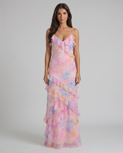 Front view of pink tie-dye maxi dress with layered ruffle trim and cascading skirt detail