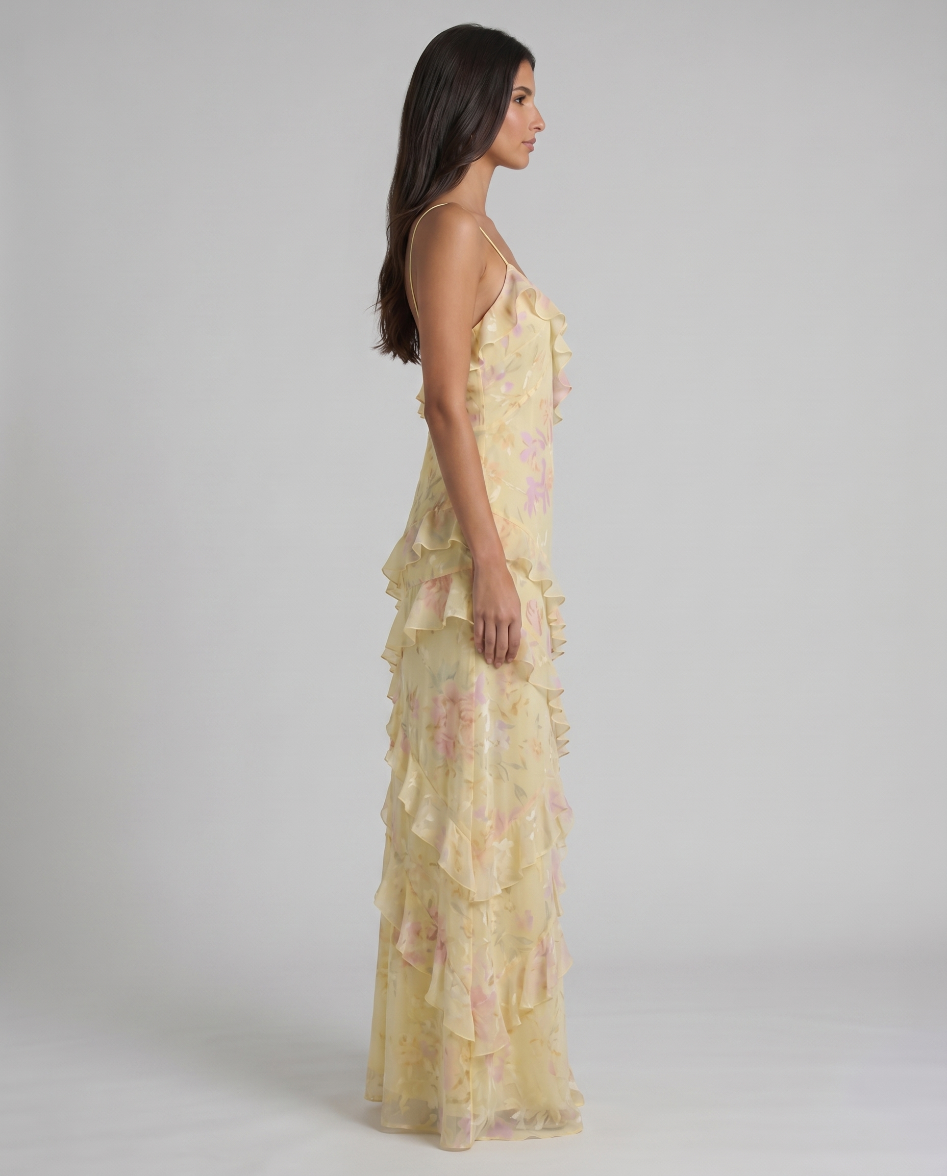 Left side view yellow floral maxi dress with spaghetti straps and cascading tiered ruffles